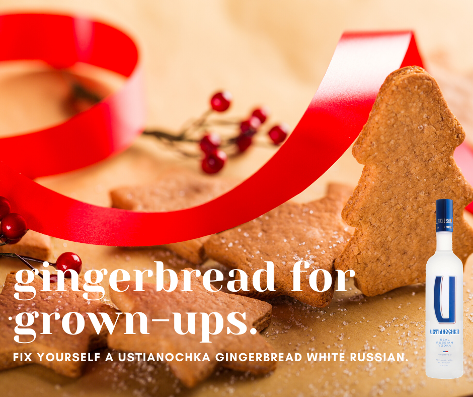 A gingerbread tree stands amid a pile of cookies and red holiday ribbon. 